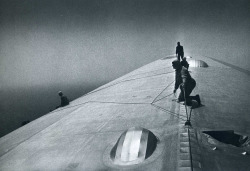 Graf Zeppelin Maintenance crewmen repairing damage caused by