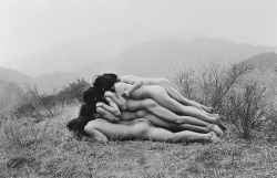 To Add One Meter to an Anonymous Mountain by Zhang Huan, 1995 