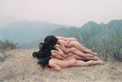 To Add One Meter to an Anonymous Mountain by Zhang Huan, 1995 