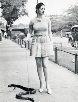 vintagegal:  Burlesque dancer Zorita walks her pet snake c. late