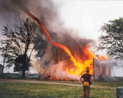  Fire from a burning building being sucked into a tornado. 