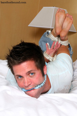 boundandbarefoot:  Micah barefoot, hogtied, and gagged. 