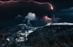 newsflick:  A lightning bolt streaks across the sky as a volcano