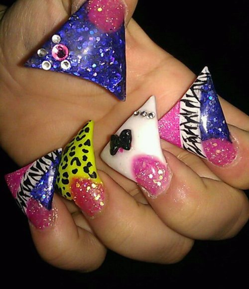 satanie:  nikkilipstick:  my friends nails! she crazy!  Oh god! I can’t imagine opening a can of soda or anything with those nails.  This looks fucking atrocious, I hope they break and take her fingernails. Just why the fuck would you want to do this?