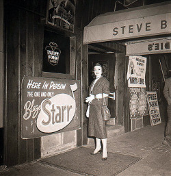 Blaze Starr poses at the entrance to ‘Steve Brodie’s