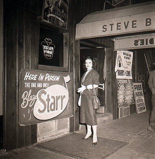 Blaze Starr poses at the entrance to ‘Steve Brodie’s Nightclub’, in Philadelphia.. She enjoyed a 28-week appearance at this venue, in 1954..