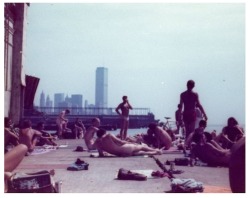     Sunbathing on the piers, New York City, 1970s. good view