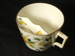 misleadthoughts:  This is a moustache cup. It was used in the