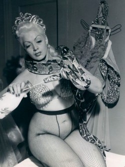 lacontessa:  Burlesque dancer Zorita feeding her snake.. 