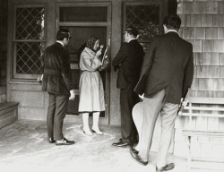 Little Edie Beale examines the eviction notice delivered to Grey