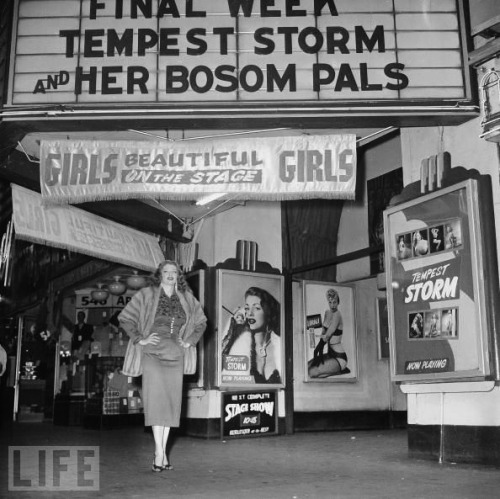 whentheroadrunsout:   Tempest Storm poses for a photo beneath the marquee of the ‘New Follies Theatre’; located in Los Angeles, California.. 