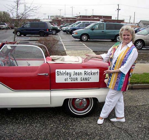 Wearing a colorful vest of her own creation, 79 year-old Shirley Jean Rickert (Measures) poses next to the vintage car that’ll transport her along the Atlantic City boardwalk, in a 2005 ‘Sons of the Desert’ reunion parade.. Before she