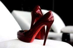 kitten must own a pair of beautiful ruby red pumps soon!