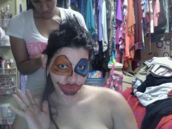 getting my hair done with my clown make-up ON!!!!