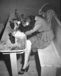 Lady feeling the effects of too much liquor. Kansas, 1946 ©