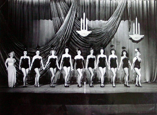 Likely taken in the early 1950’s,– the chorus line of the ‘New Follies Theatre’ in Los Angeles, pose for a formal group photo.. Wish I could identify the performers for you, but I’d be guessing.. The brunette 2nd from the