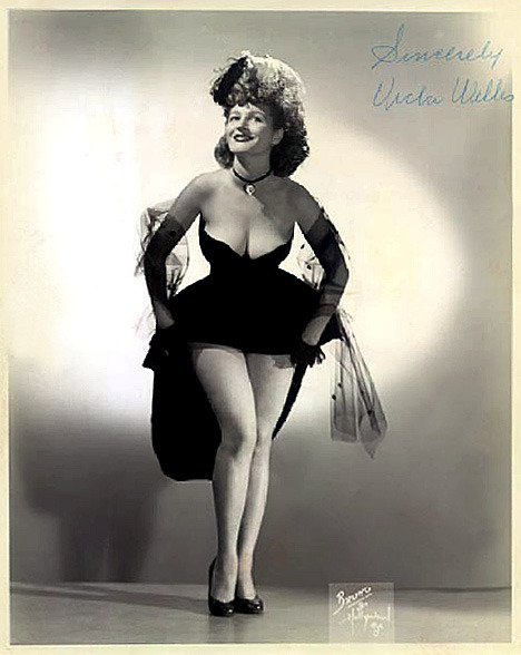 Autographed promo photo of:   Vicki Welles  aka. “The Radiant Red-Haired A'Peeler”..