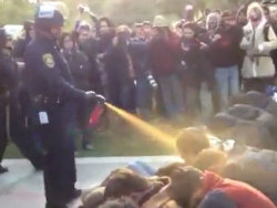 nationalpost:  Screen grab of police in riot gear spraying what