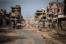 kilele:  A general view of buildings ravaged by fighting in Sirte,