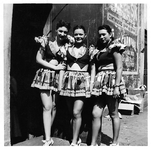 A candid photo from August of ‘53, taken behind an unidentified Detroit burlesque theatre.. Featured here, (Left to Right) are chorus girls: Pat Marsh, June Albert (Line Captain), and Vivian..