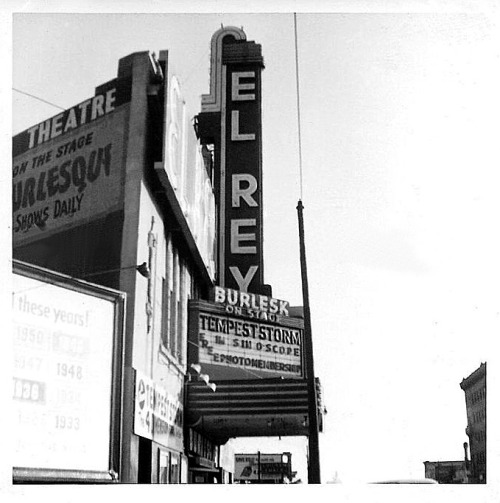 Tempest Storm appears in “Sin-O-Scope” according to the marquee of Oakland’s famed ‘EL REY Theatre’, in this vintage photo from 1953.. Ms. Storm achieved notoriety with Burly-Q fans after her debut at Los Angeles’ ‘FOLLIES