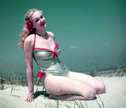 Lynne O’Neill models her silver lamé swimsuit in the dunes,