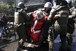 thedailywhat:  War On Christmas of the Day: A Chilean demonstrator