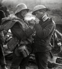  British and German soldiers exchanging cigarettes and other