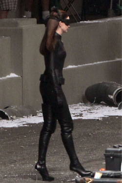 gasstation:  Anne Hathaway on the set of â€œThe Dark Knight Risesâ€  Is there no sissy bitch on set that can lick those boots clean?