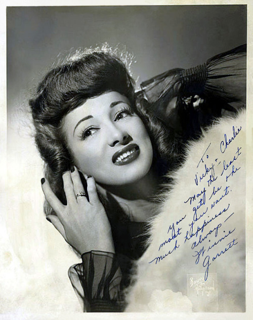     Winnie Garrett   aka. “The Flaming Redhead”.. Vintage 40’s-era promo photo personalized: “To Vicky & Charlie — May the least you get be the most you want. Much happiness always.. — Winnie Garrett”    