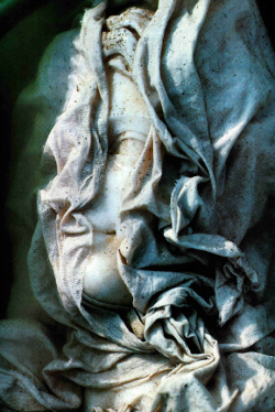 cratered:  Veiled to uncover her beauty, the head of a second-century