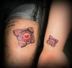 fuckyeahtattoos:  Matching Companion Cubes from the game Portal