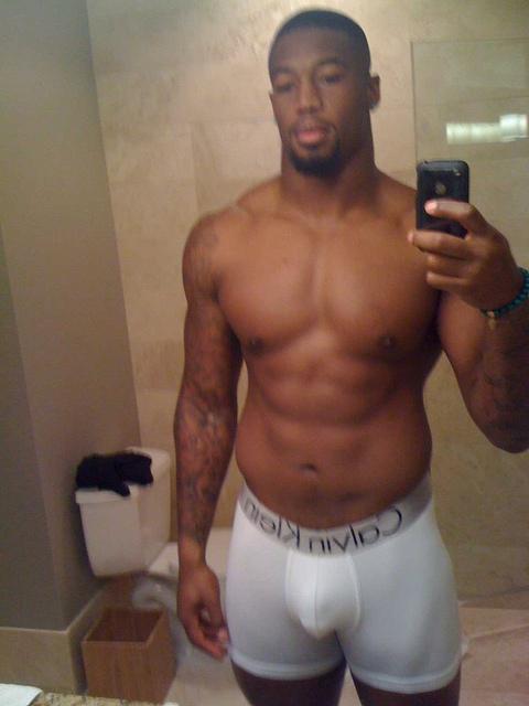 mistahsonasty:  Ray Edwards Nfl player is so mf sexy! Check the nipple piercing, tight ass underwear. U know he getting down on the low.Â  