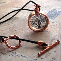 steampunkfinds:  Copper surrounding an image set in resin. 