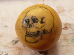 Just did my first tattoo.   Free-handed a skull on a grapefruit. 