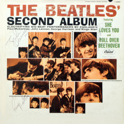  Album covers signed by all the Beatles 