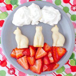 gastrogirl:  kitty cat cakes with whipped cream and strawberries.