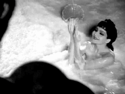  Claudette Colbert takes a milk bath in the nude in the pre-code