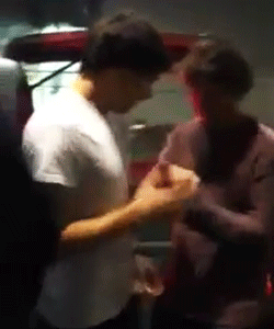  Lou hurts his hand so Liam kisses it better. (x) 