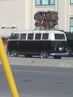 Random site of the day. Tyrannosaurus head on top of a VW van.
