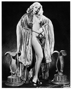 Lili St. Cyr poses for a Bruno Bernard promo photo, wearing her