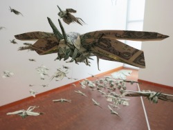 machine-factory:  A swarm of locusts made entirely out of money.