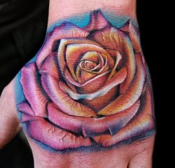 fuckyeahqualitytattoos:  a proper flower/hand tattoo by Cecil