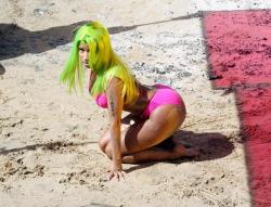  somehow… the lime green wig works for her