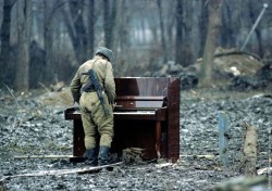   Russian soldier playing an abandoned piano, date unknown  fuck