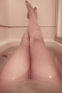 intoxifaded:  Totally innocent picture of my legs in the tub,