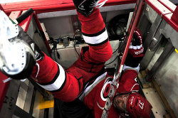 siphotos:  Tim Brent of the Carolina Hurricanes flips over the
