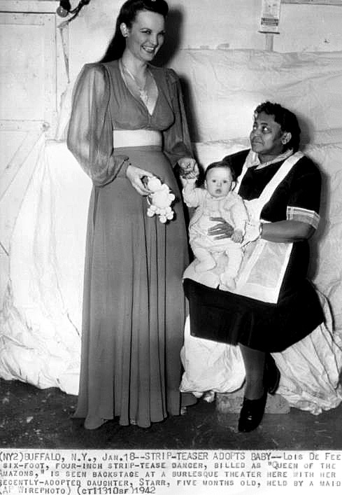    Lois DeFee   aka. “Queen of the Amazons”.. An AP wire photo from January of ‘42, highlighting Lois’ recent adoption of a 5 month-old baby girl that she has named: “Starr”.. Photo courtesy of the Janelle Smith collection..