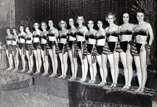 A vintage press photo from September of ‘32, captures the entire Chorus Line of showgirls onstage at the ‘EMPRESS Burlesque Theatre’; in Detroit, Michigan..