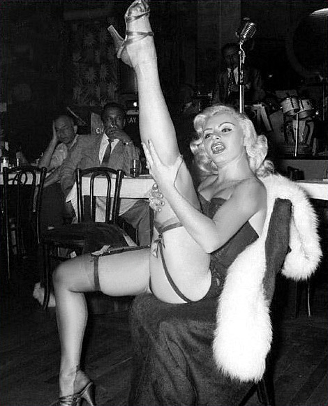 Rita Grable kicks up a shapely leg, during a performance at an unidentified 50’s-era nightclub..